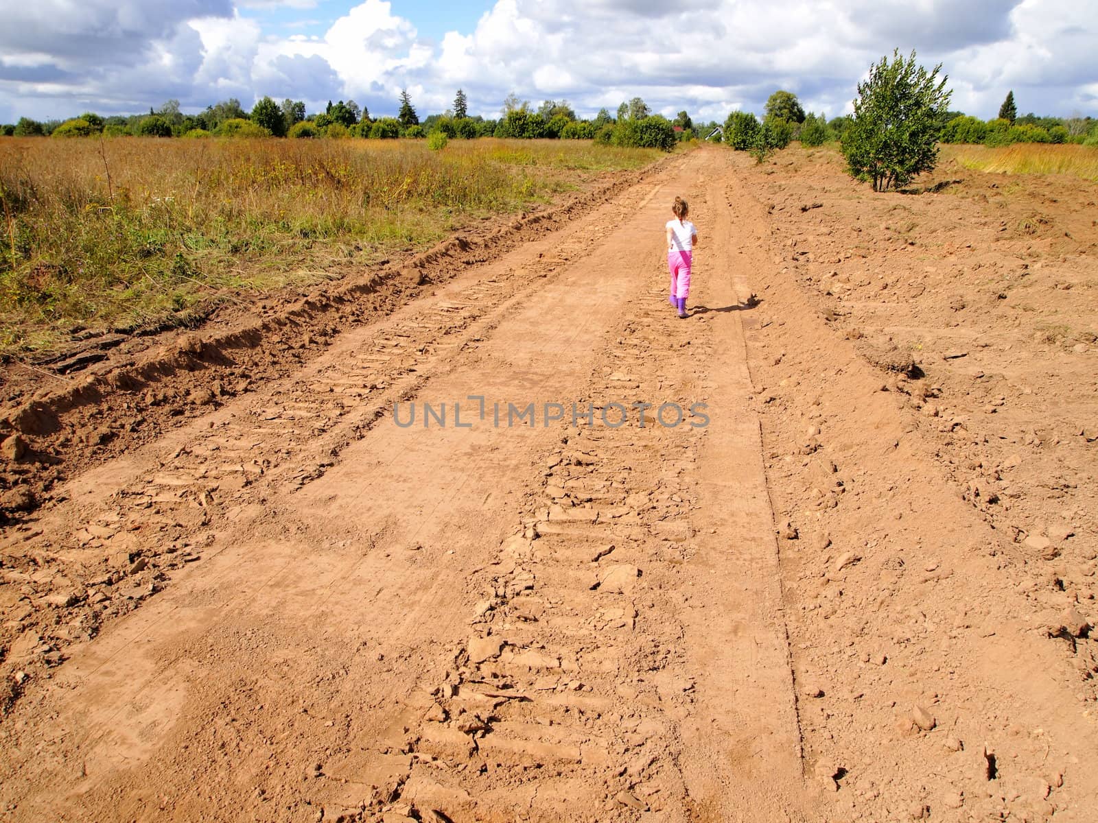 child is on the unfinished road