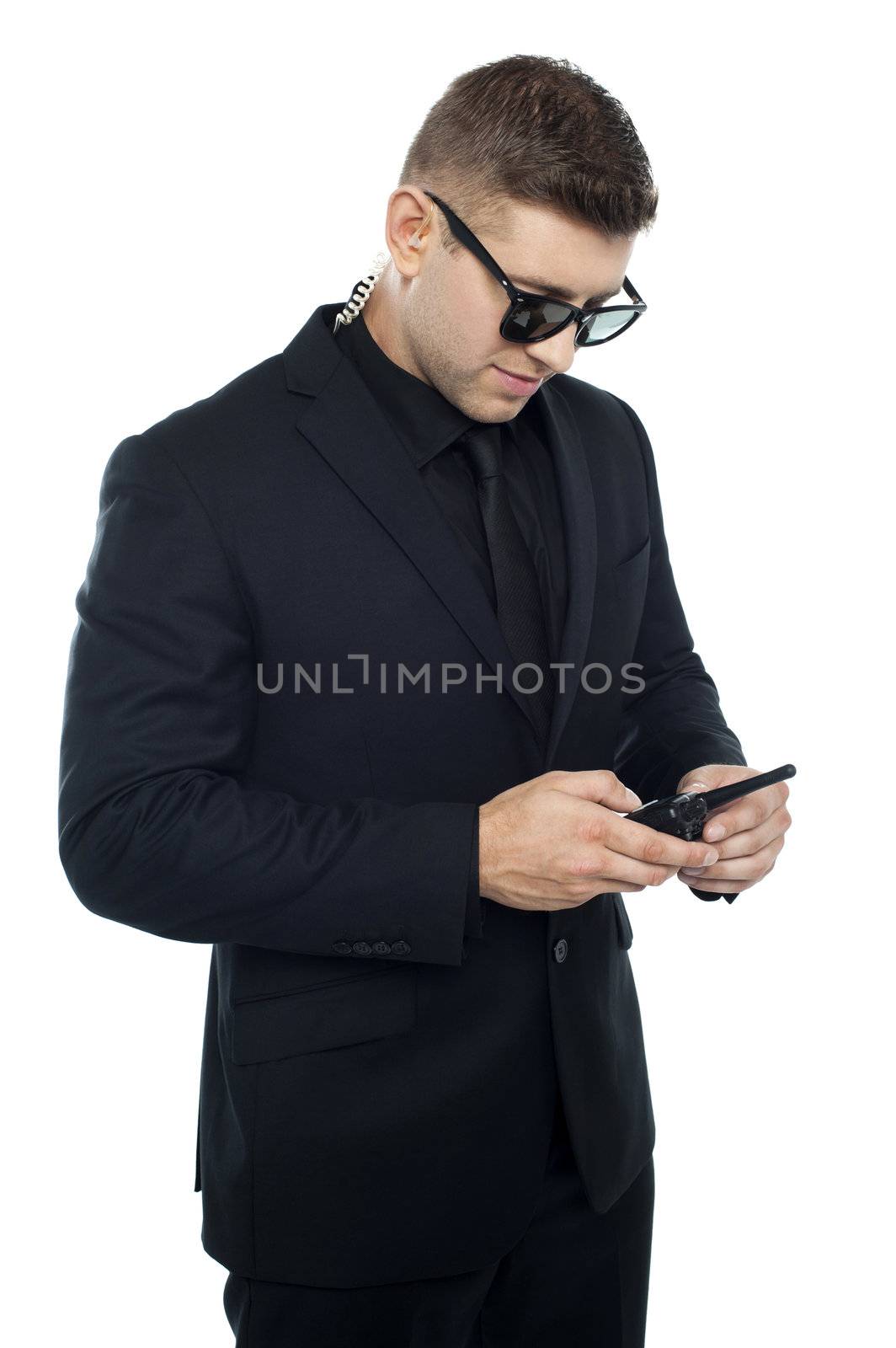 Security officer dialing number on his walkie-talkie isolated against white background