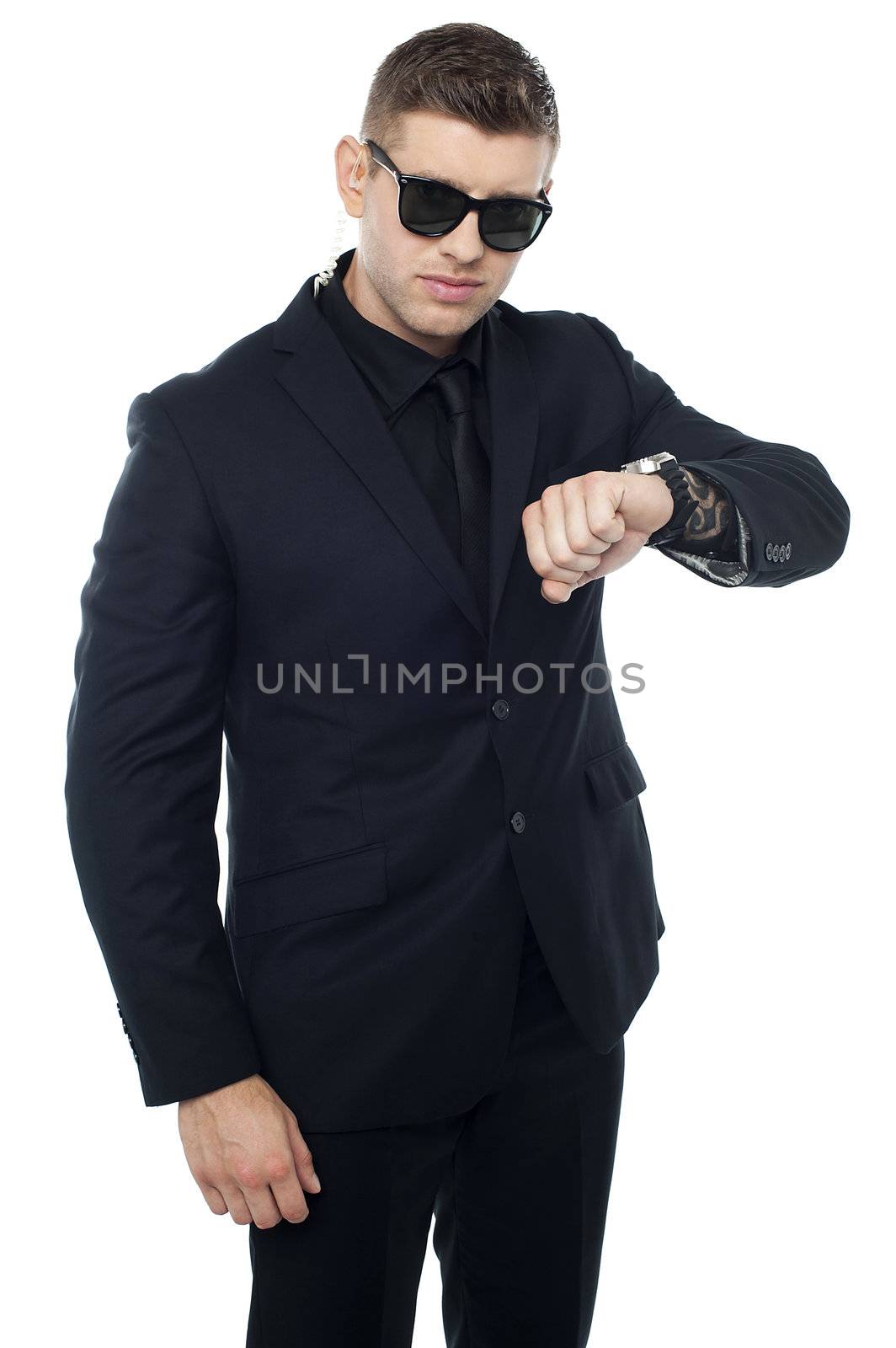 Tough security officer in black suit. Its time for some action