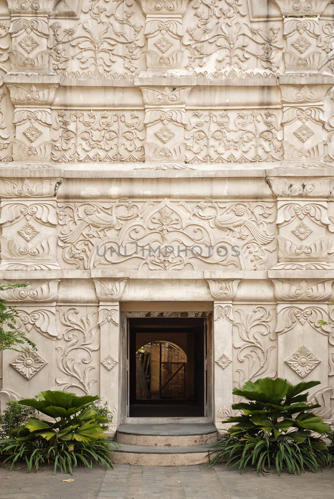 carved stone entrance to palace in solo indonesia