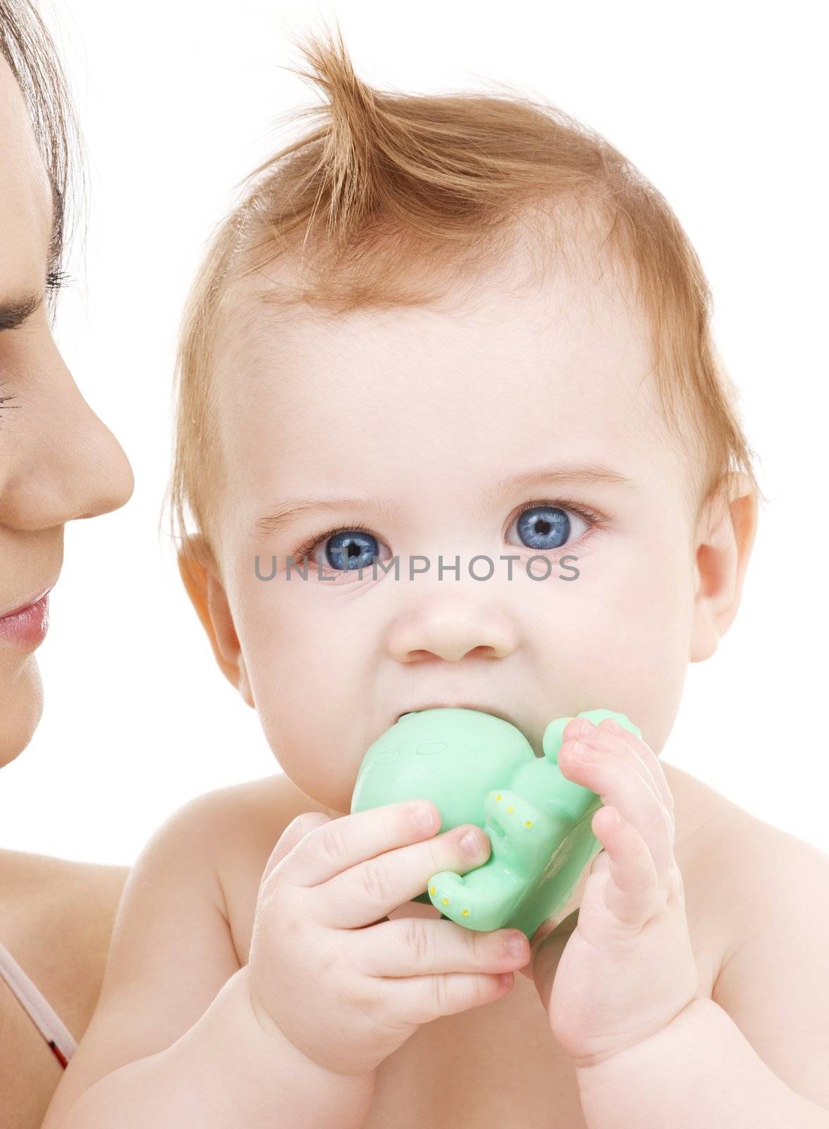 picture of baby boy with green plastic toy