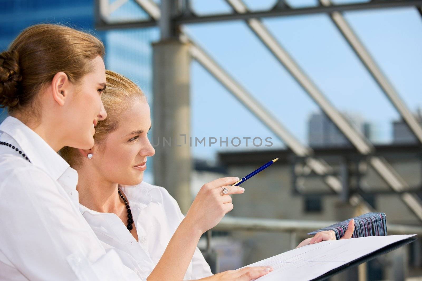 picture of two happy businesswomen (focus on blonde)