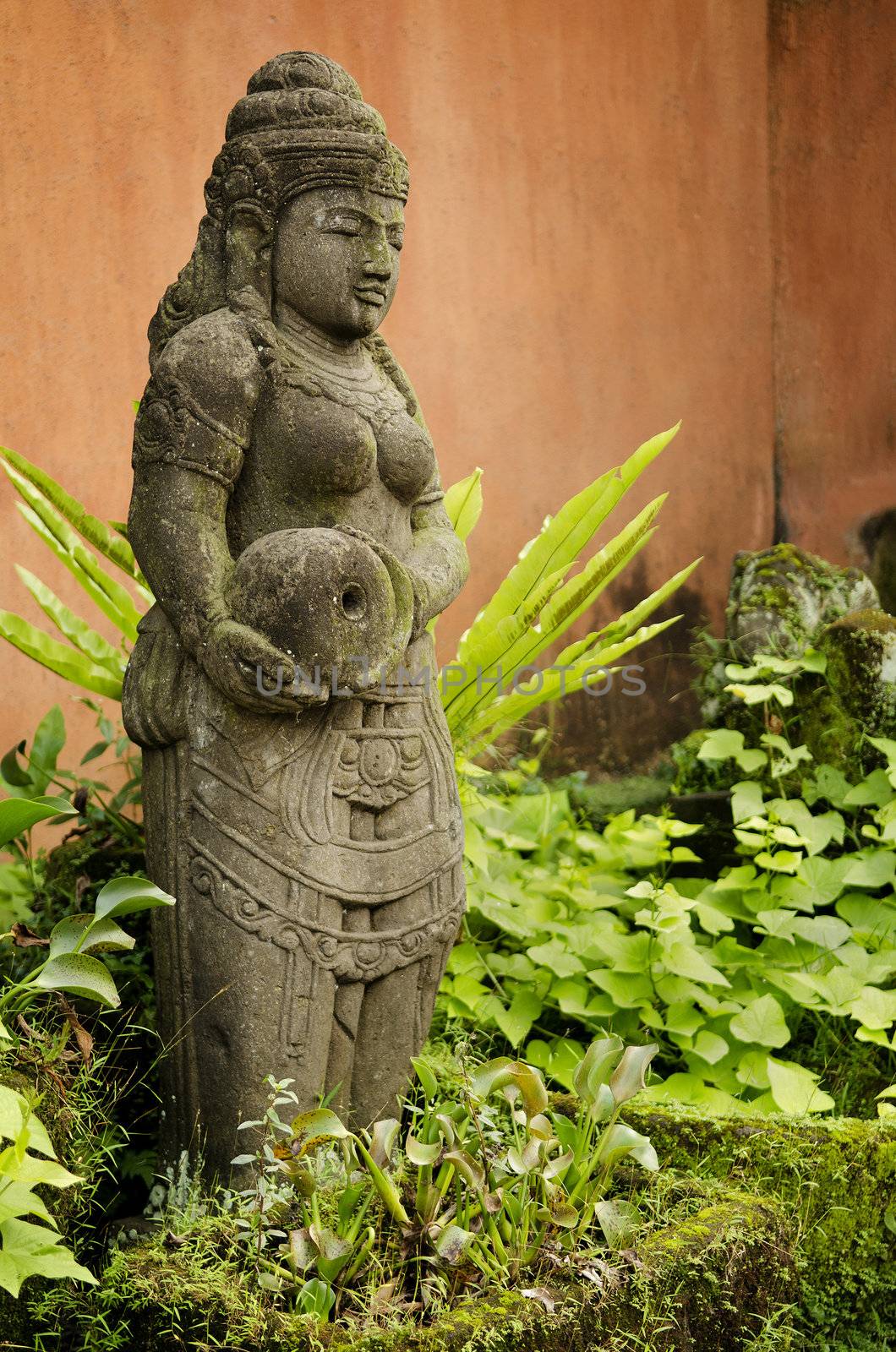 statue in bali indonesia garden by jackmalipan