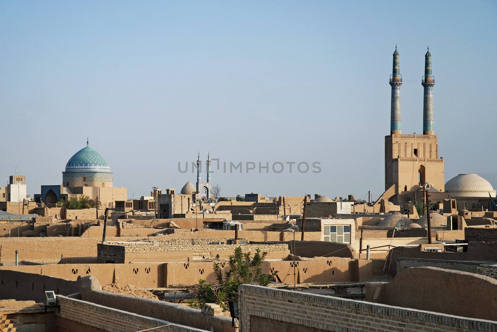 view of rooftops in yazd iran by jackmalipan