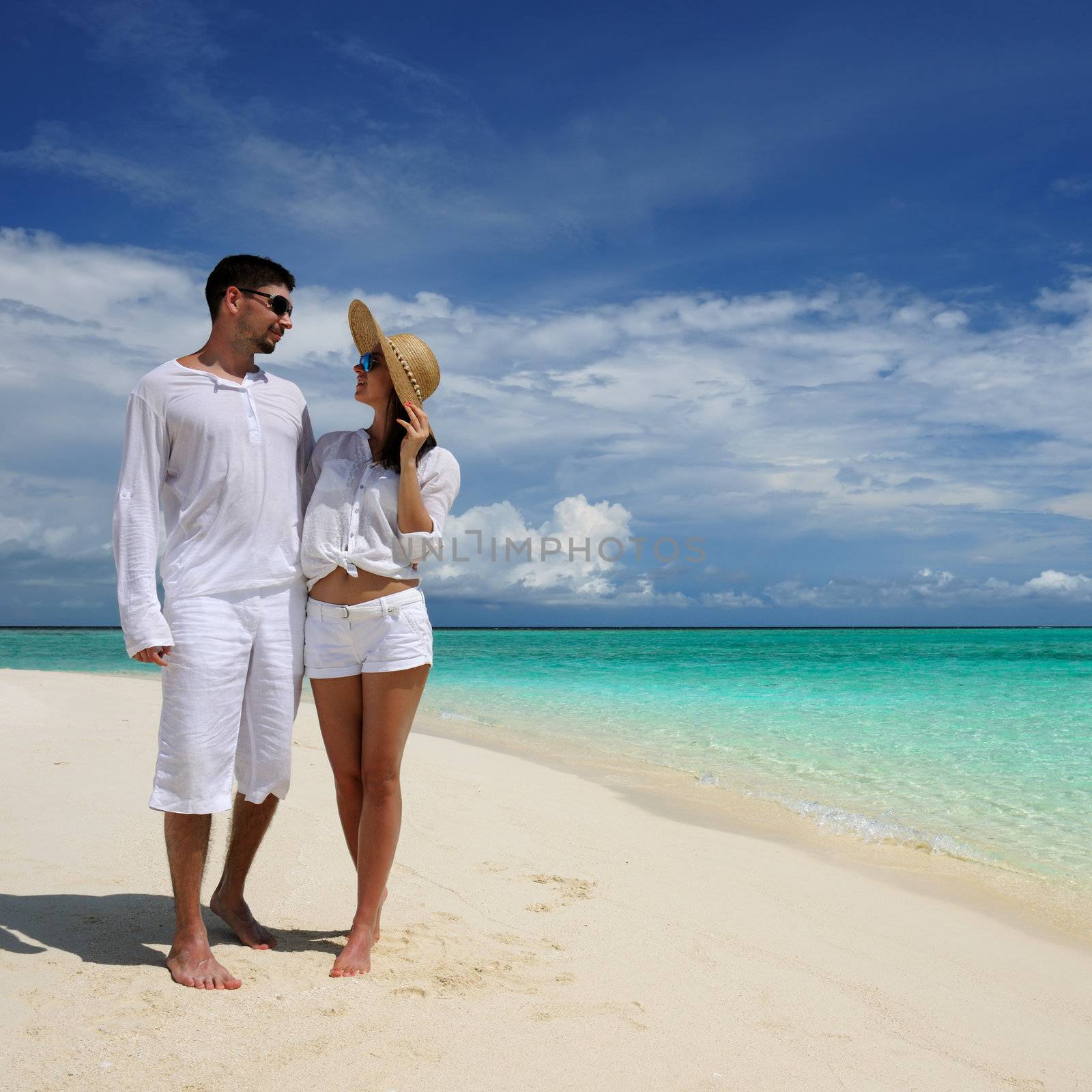 Couple on a tropical beach at Maldives