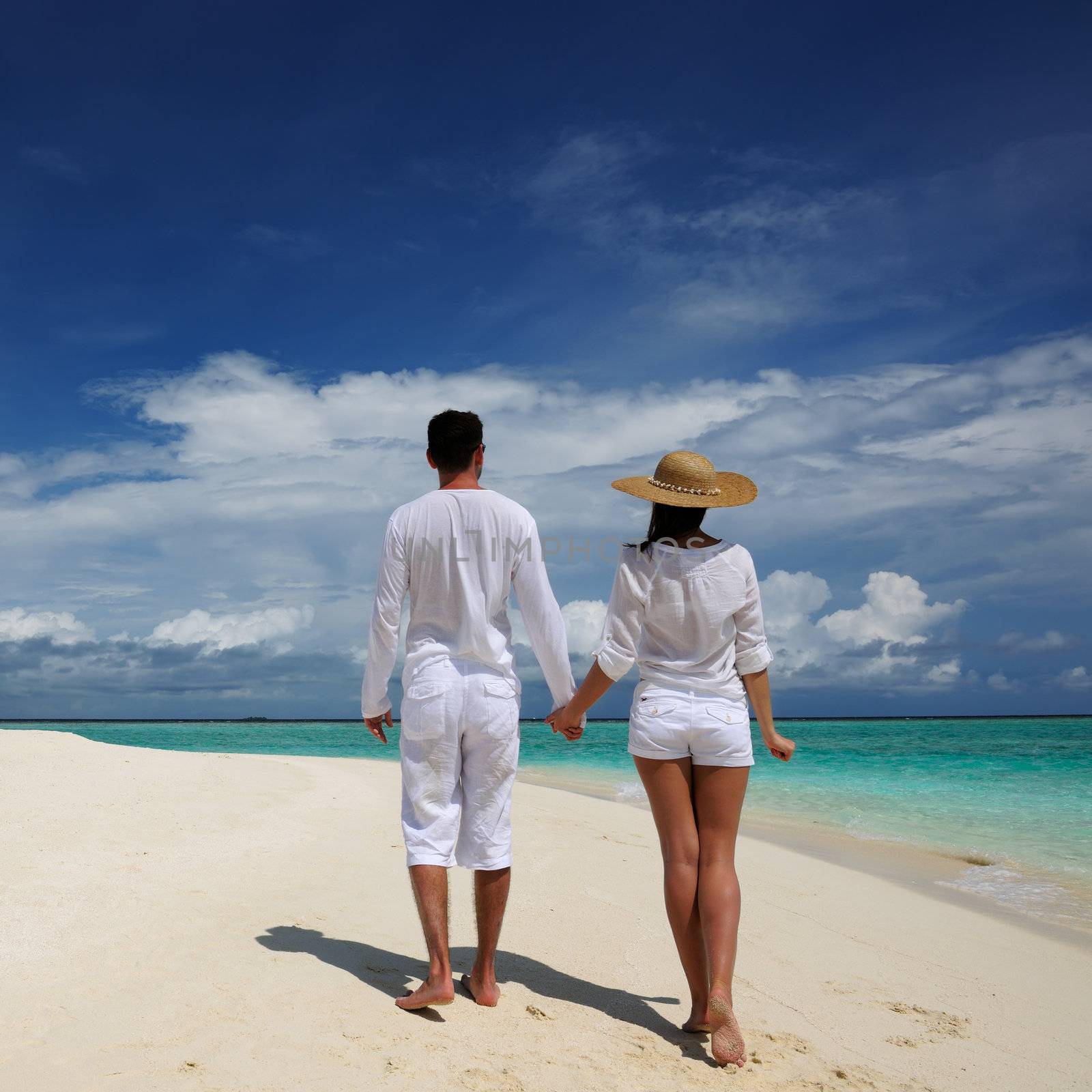 Couple on a tropical beach at Maldives