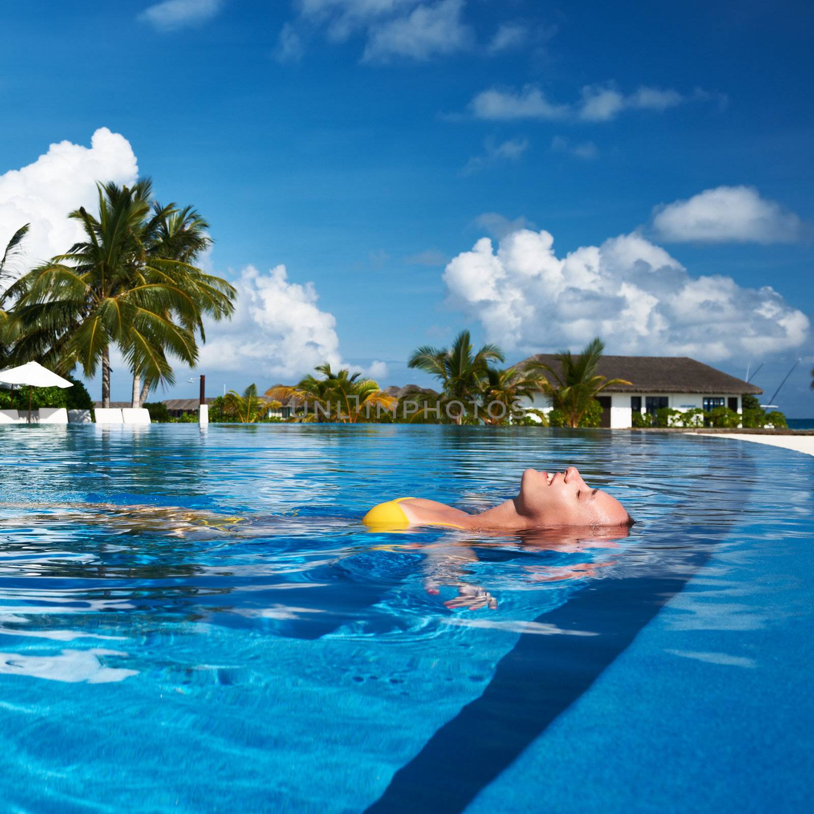 Woman at poolside by haveseen