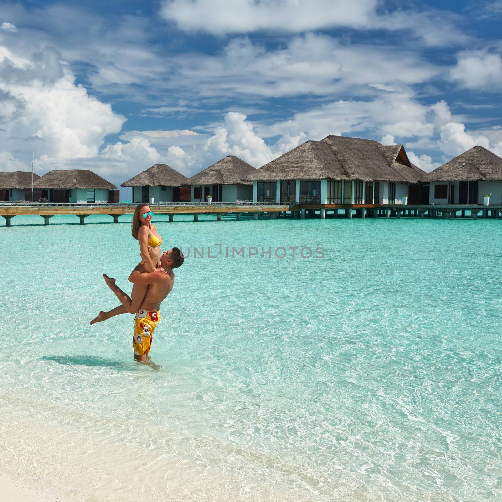 Couple on a tropical beach at Maldives