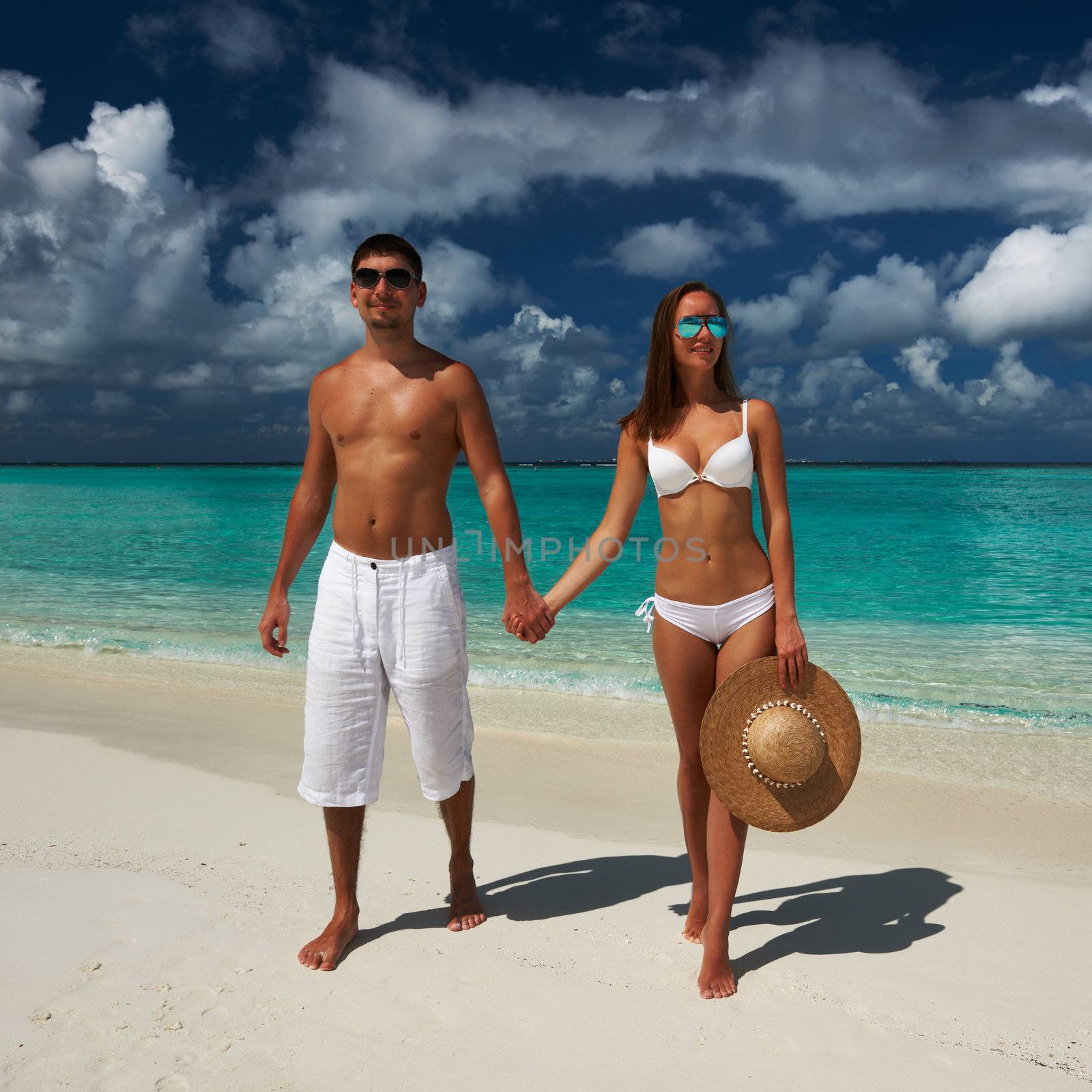 Couple on a tropical beach at Maldives