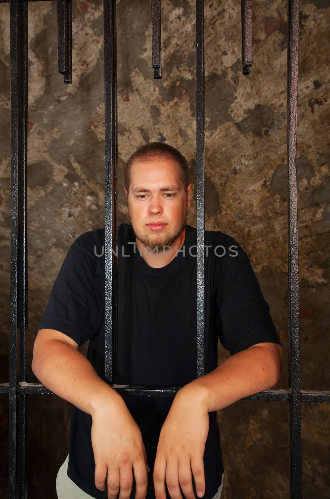 Young man behind the bars by AndreyKr