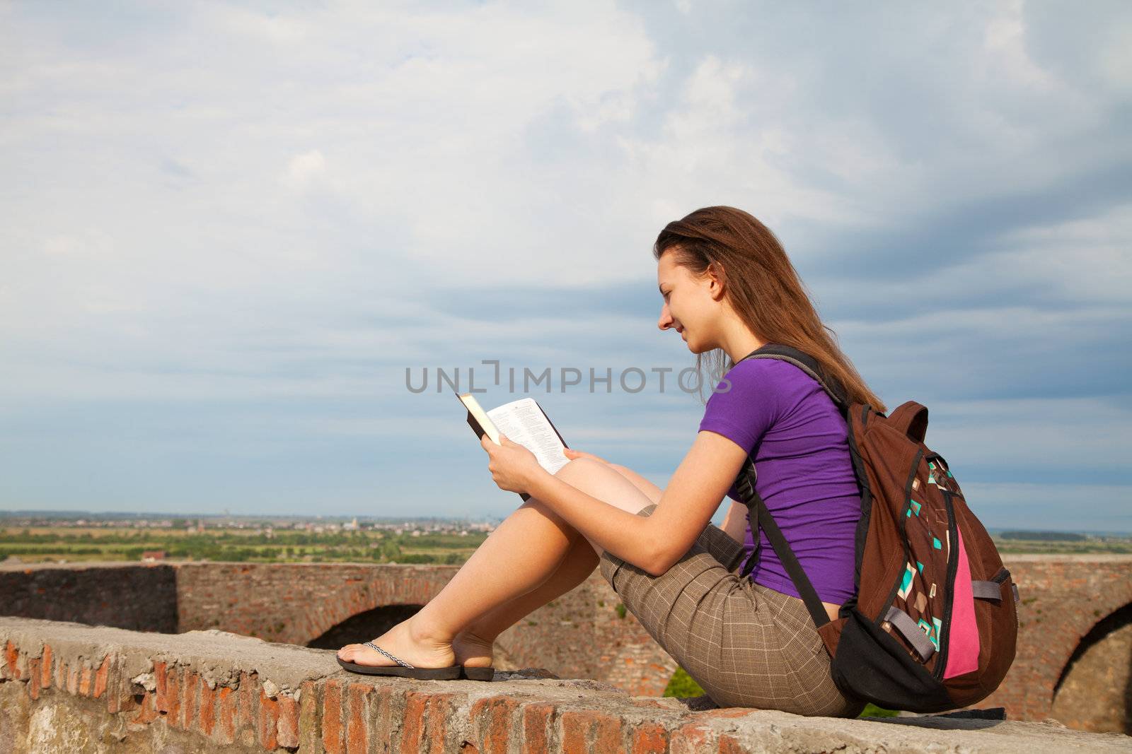Teen girl reading the Bible by AndreyKr