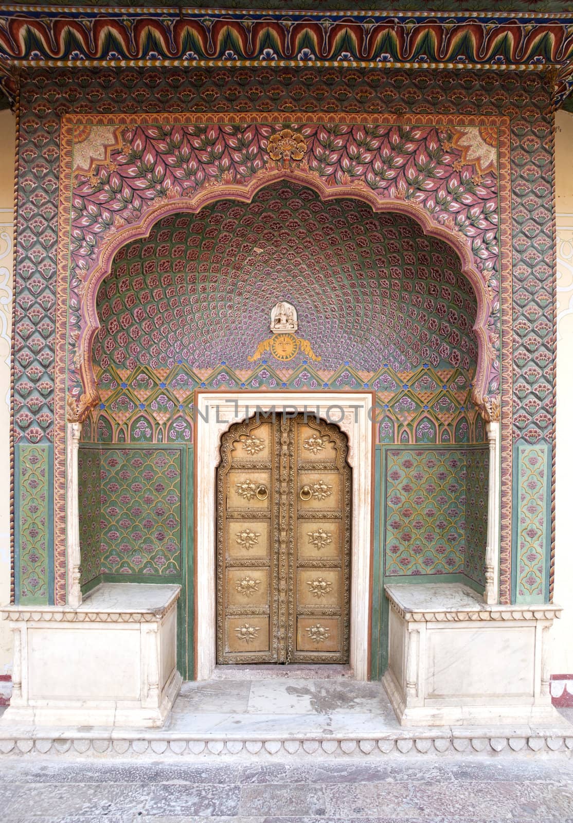 Art work on the small gate to the inner courtyard of the City Palace of Jaipur, Rajasthan, India.