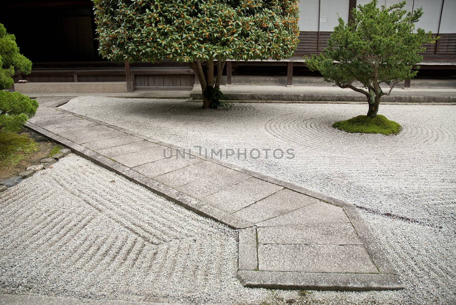 japanese traditional stone garden in kyoto japan by jackmalipan
