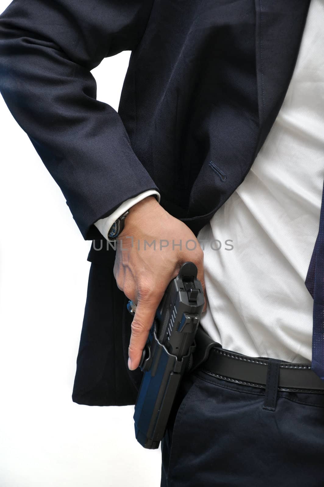 Agent wearing white shirt drawing gun from holster