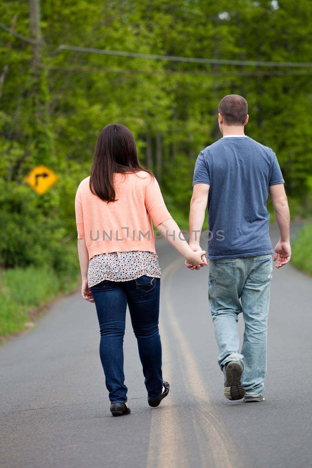 Couple Walking Down the Road Together by graficallyminded