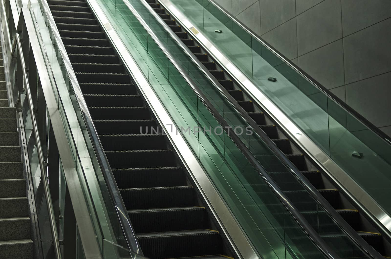 detail of modern glass and metal escalator