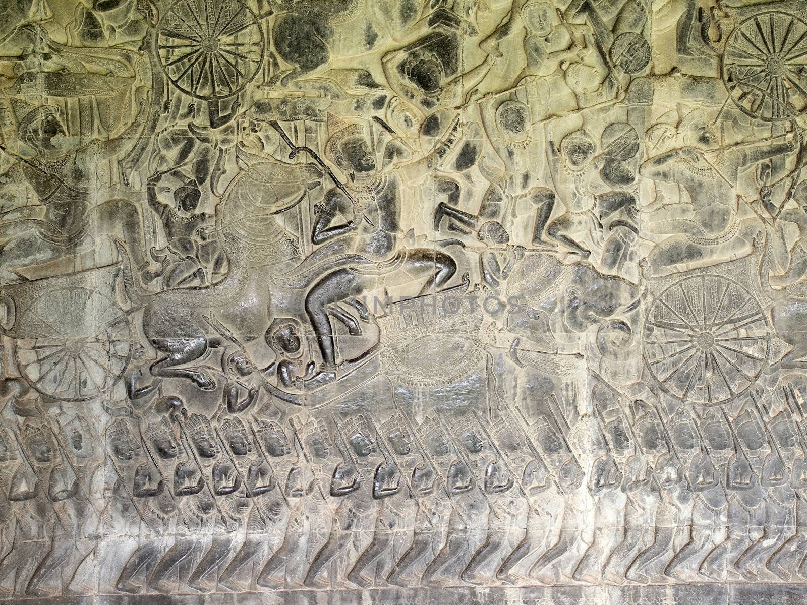 Stone carvings of the army bas relief on the corridor of Angkor Wat Temple in Siem Reap, Cambodia.