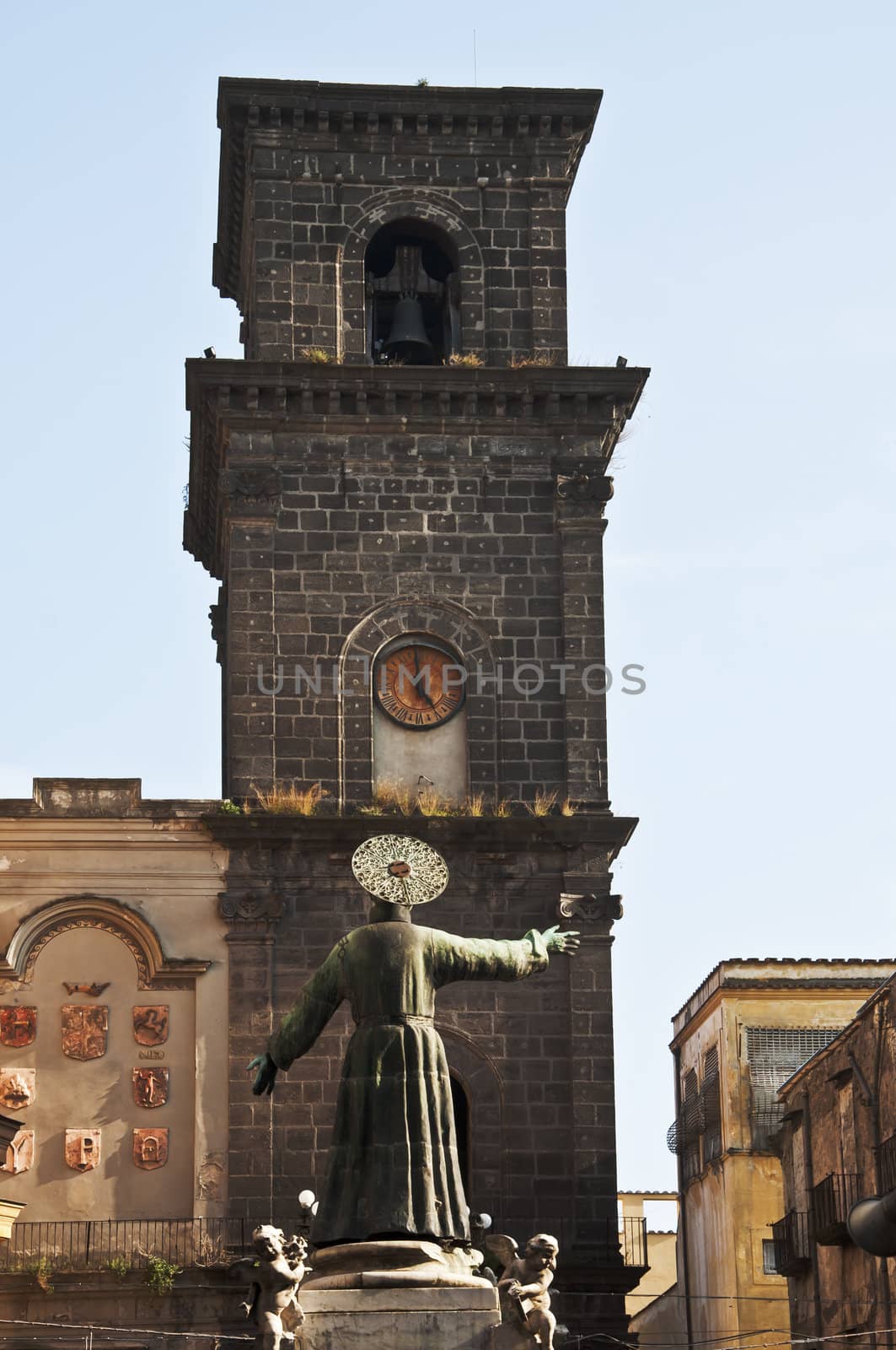 statue and tower bell in San Lorenzo, Naples, Italy