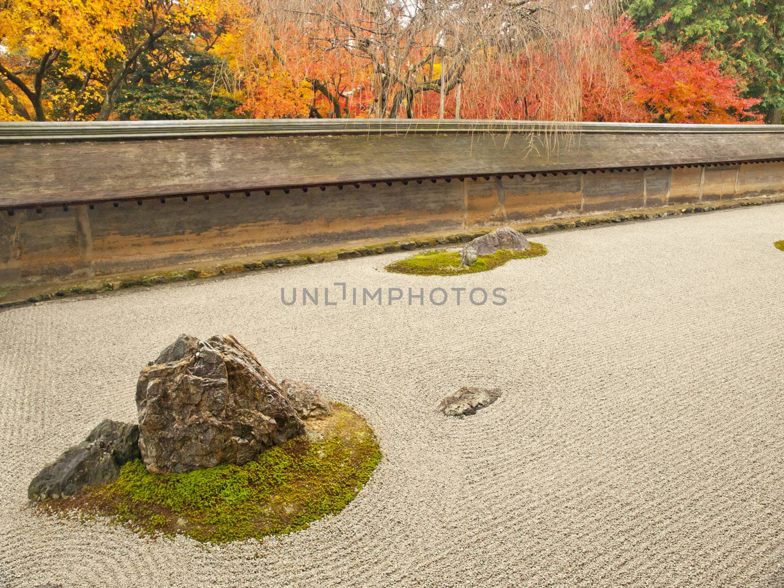 Famous rock garden of Ryoan-ji Temple in autumn, Kyoto, Japan
