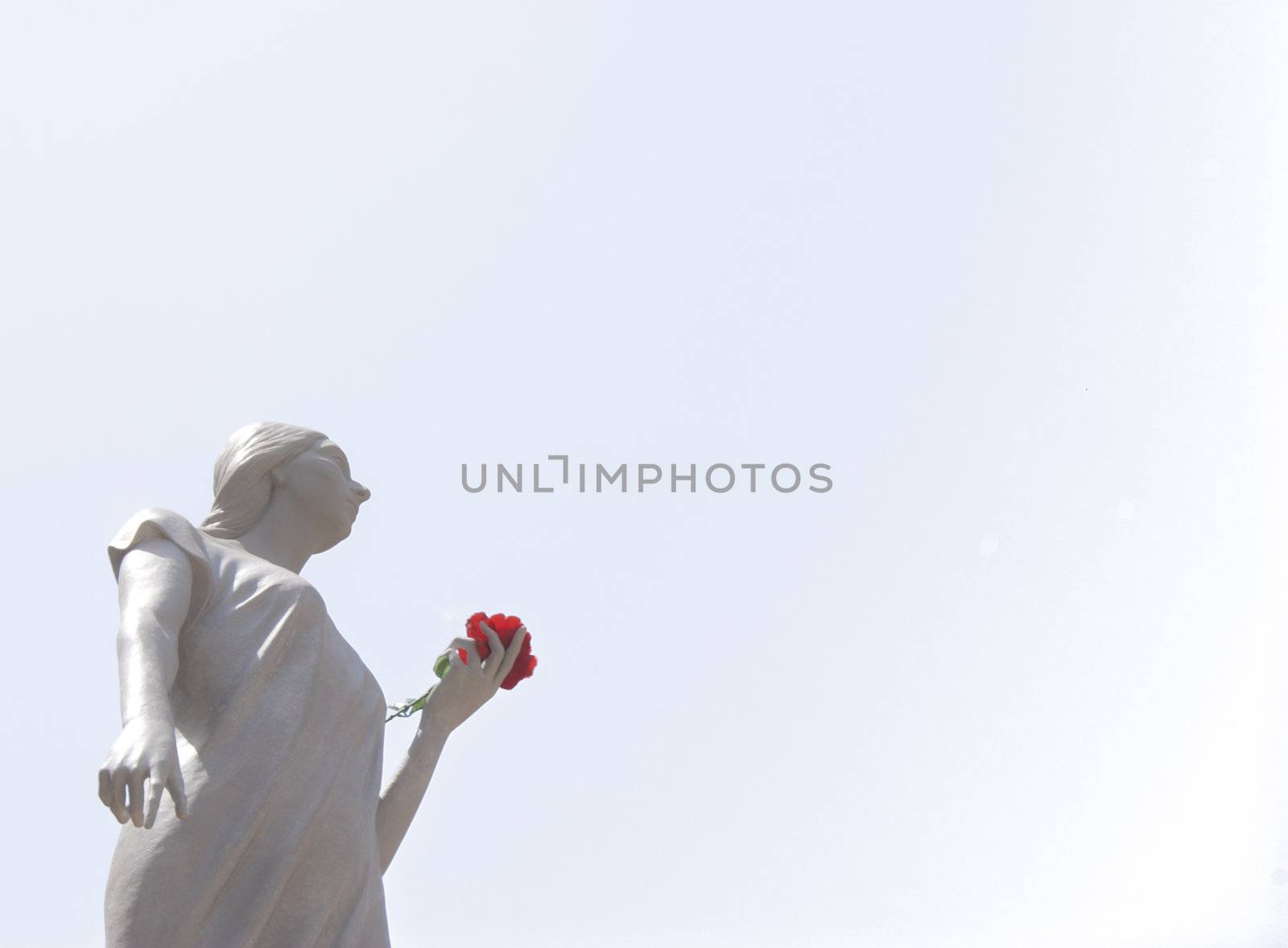 Sculpture of santa rosalia with red rose in hand isolated on white background. Palermo, Sicily