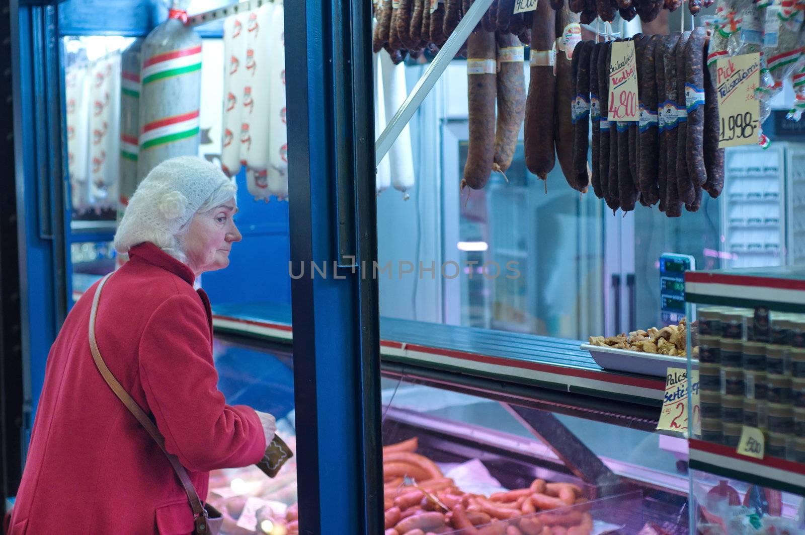 Old lady at the butcher shop