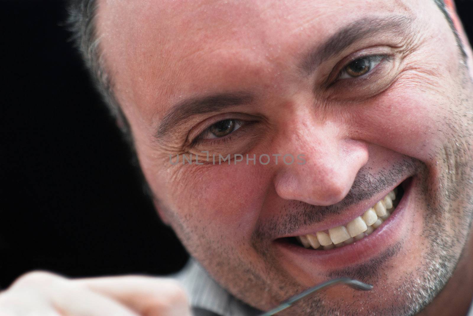 Close up portrait of smiling man by gandolfocannatella