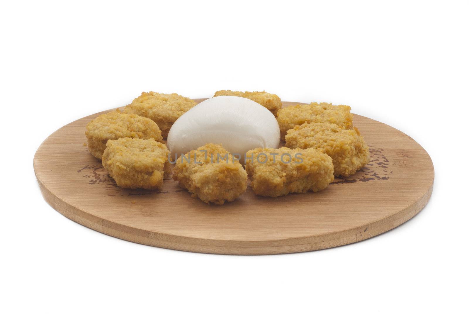 fried chicken nuggets and mozzarella cheese on wooden desk