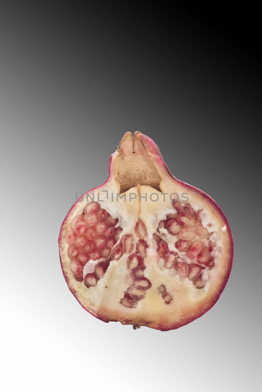 Ripe pomegranate fruit isolated on white background