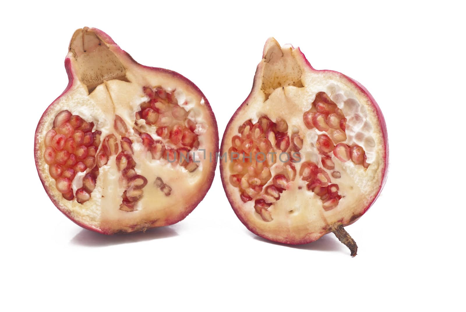 Ripe pomegranate fruit isolated on white background