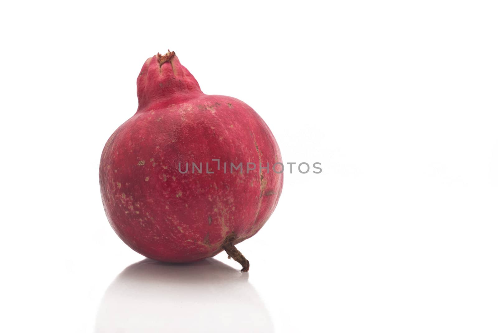 Ripe pomegranate fruit isolated on white background