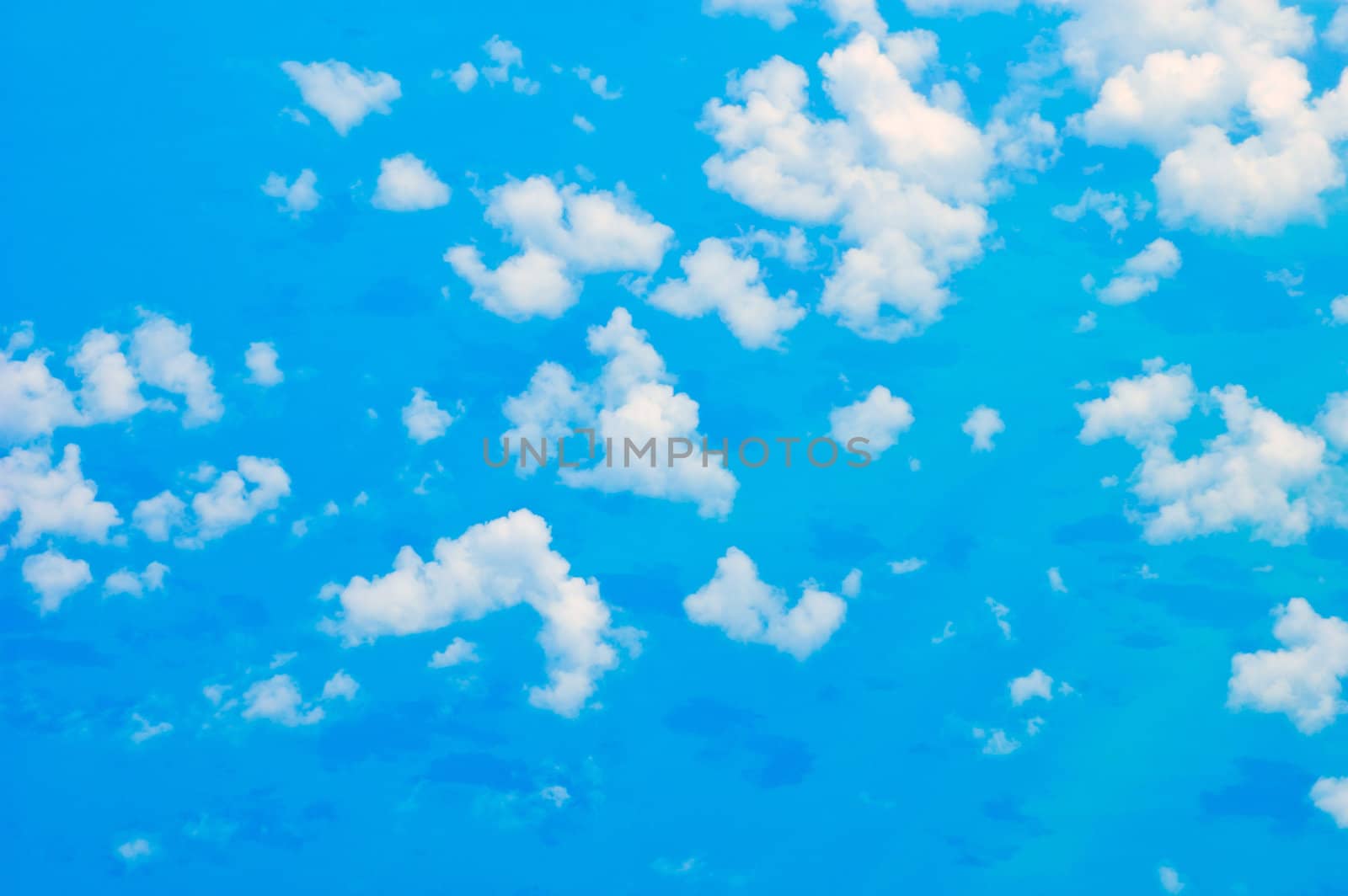 view from above of cloud and and their shodow over the ocean