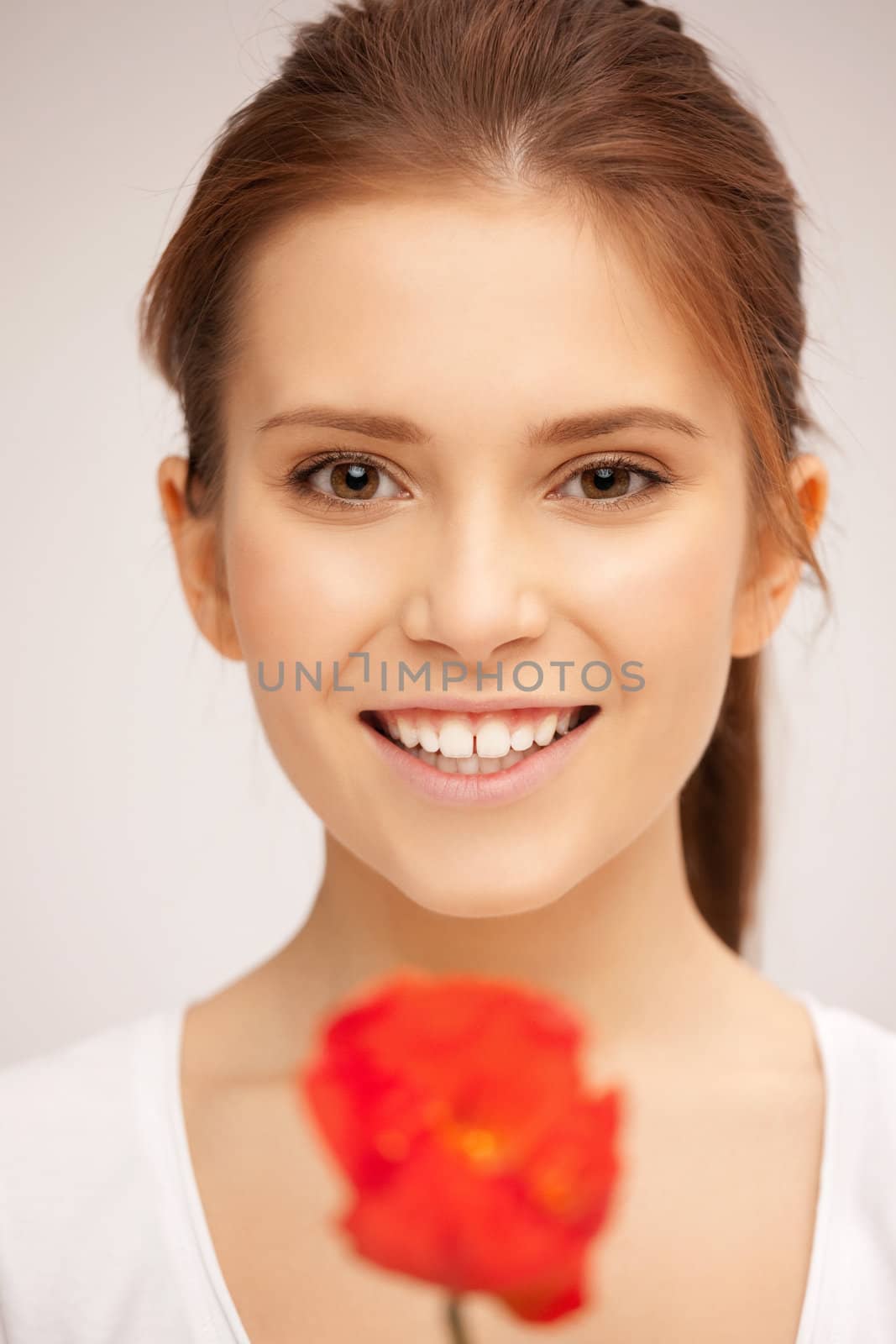 picture of beautiful woman with red flower