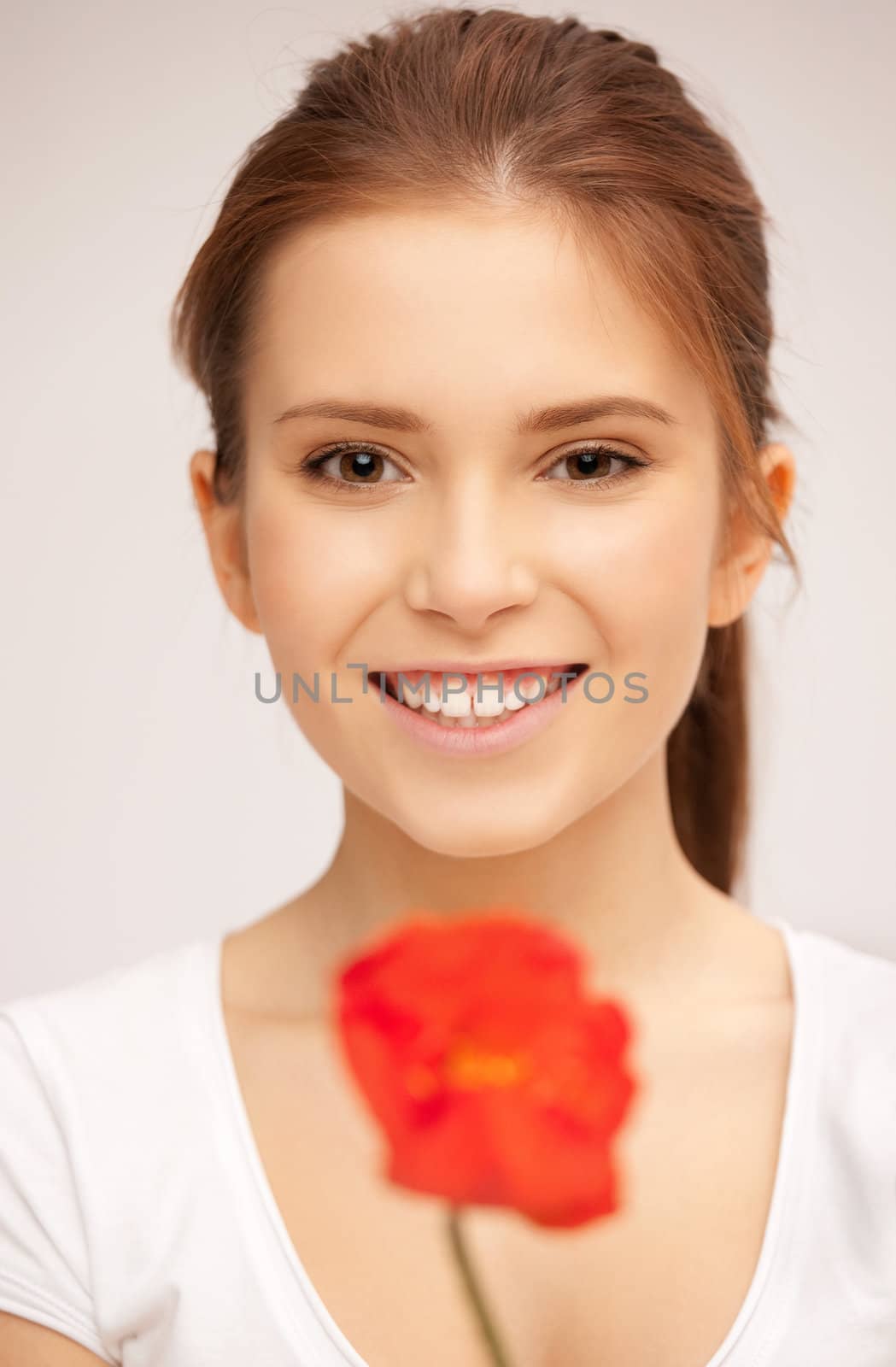 picture of beautiful woman with red flower