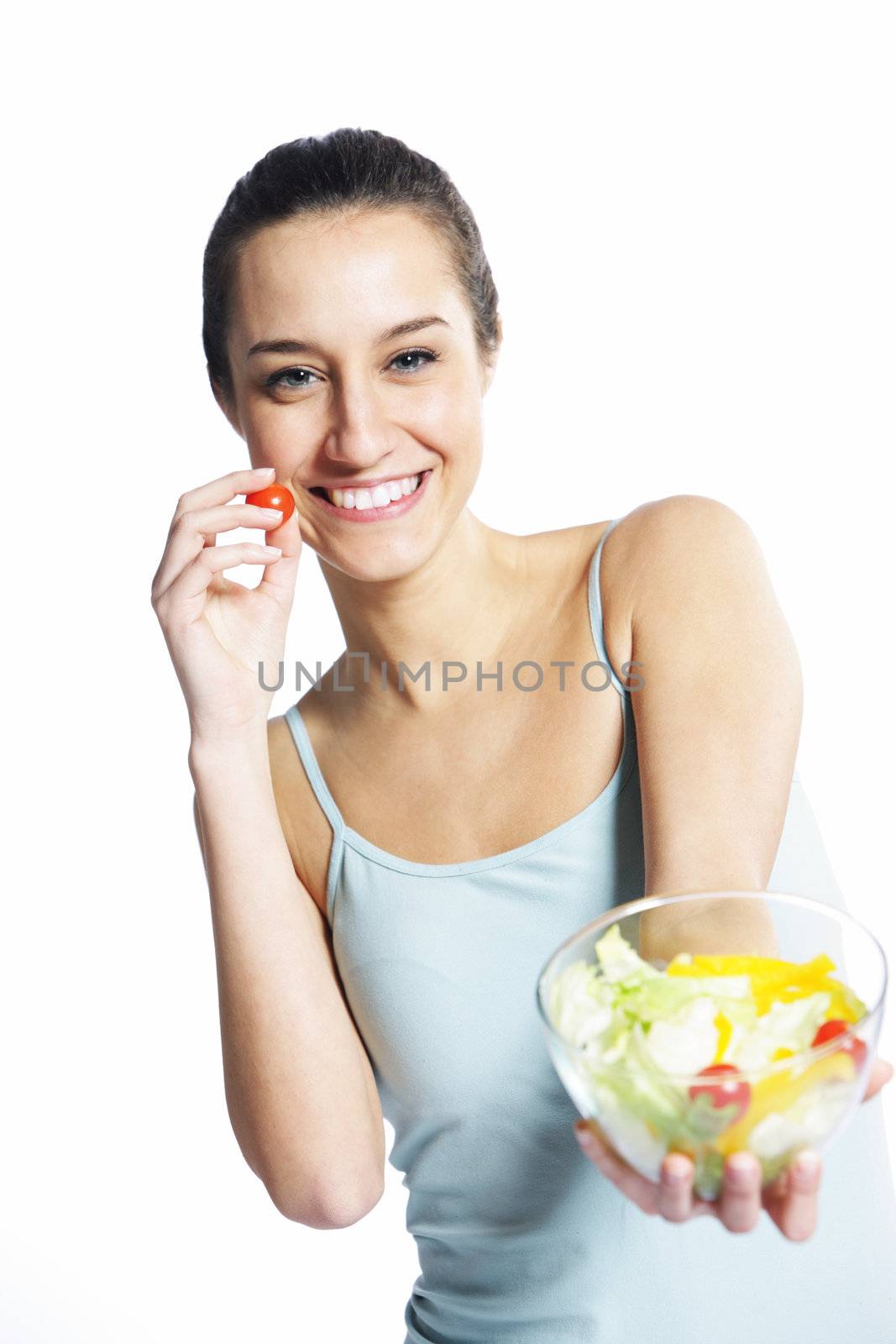 girl holding plate with salad on white background