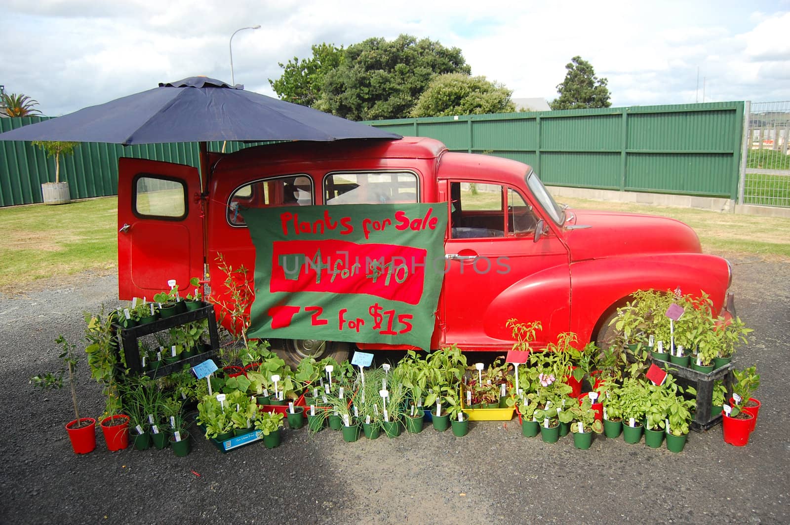 Red retro car on farmers market, Dargaville, New Zealand