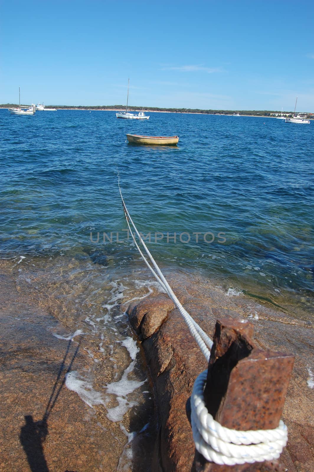 Rail jetty boat with rope, Port Lincoln, South Australia