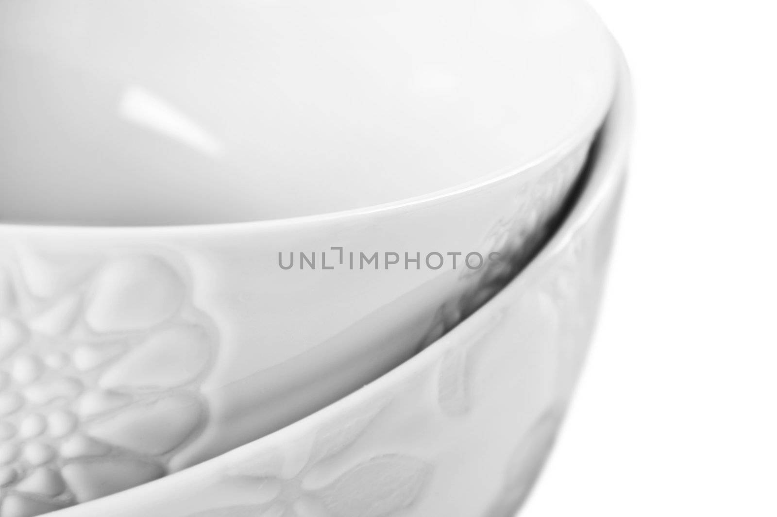 Close up of two white bowls on white by tish1