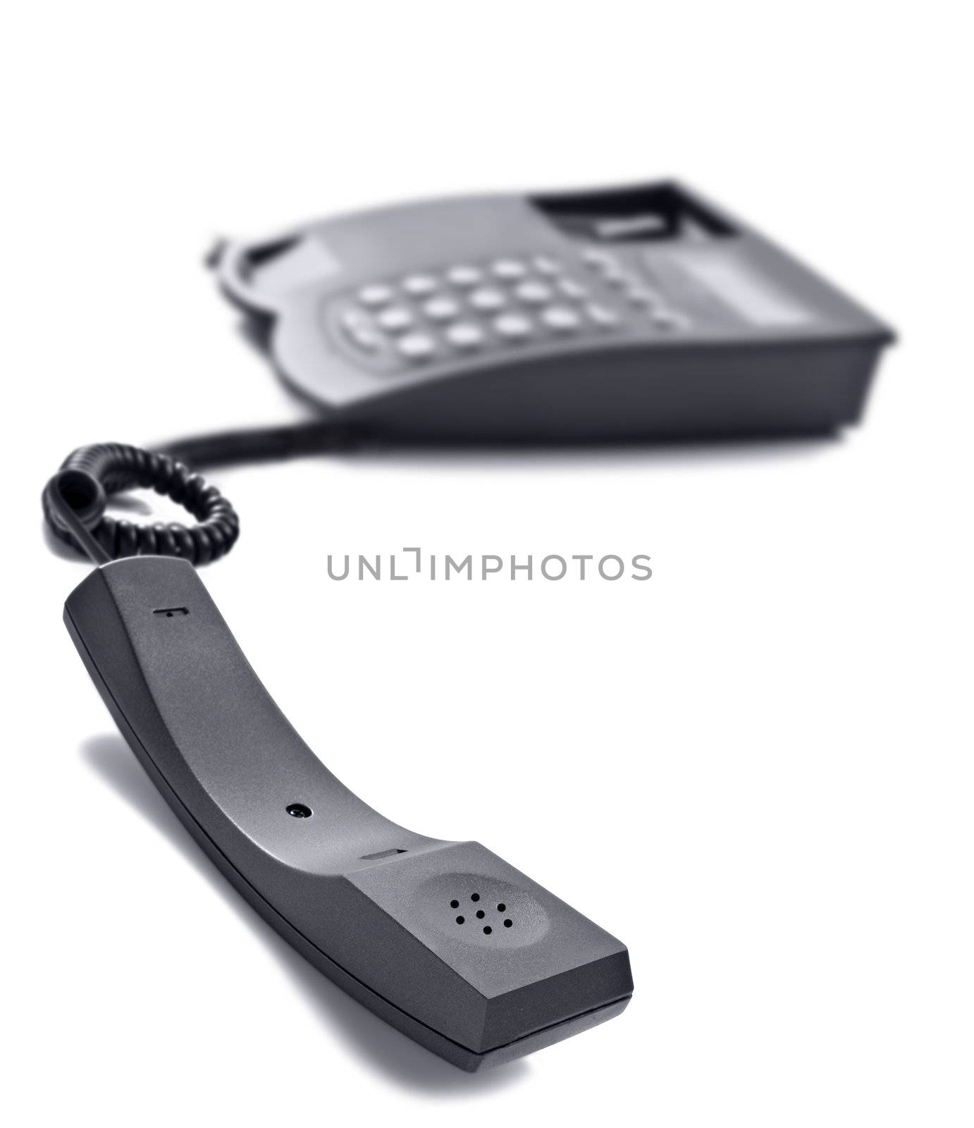 Black telephone on white with space for text