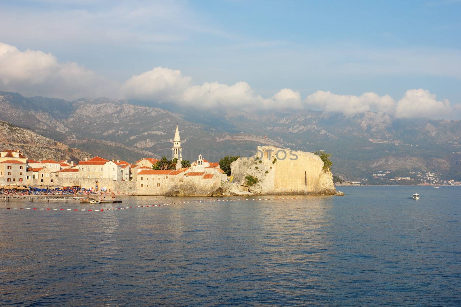 Panoramic view toward the old part of Budva in Montenegro, shot in the warm light of the late afternoon.