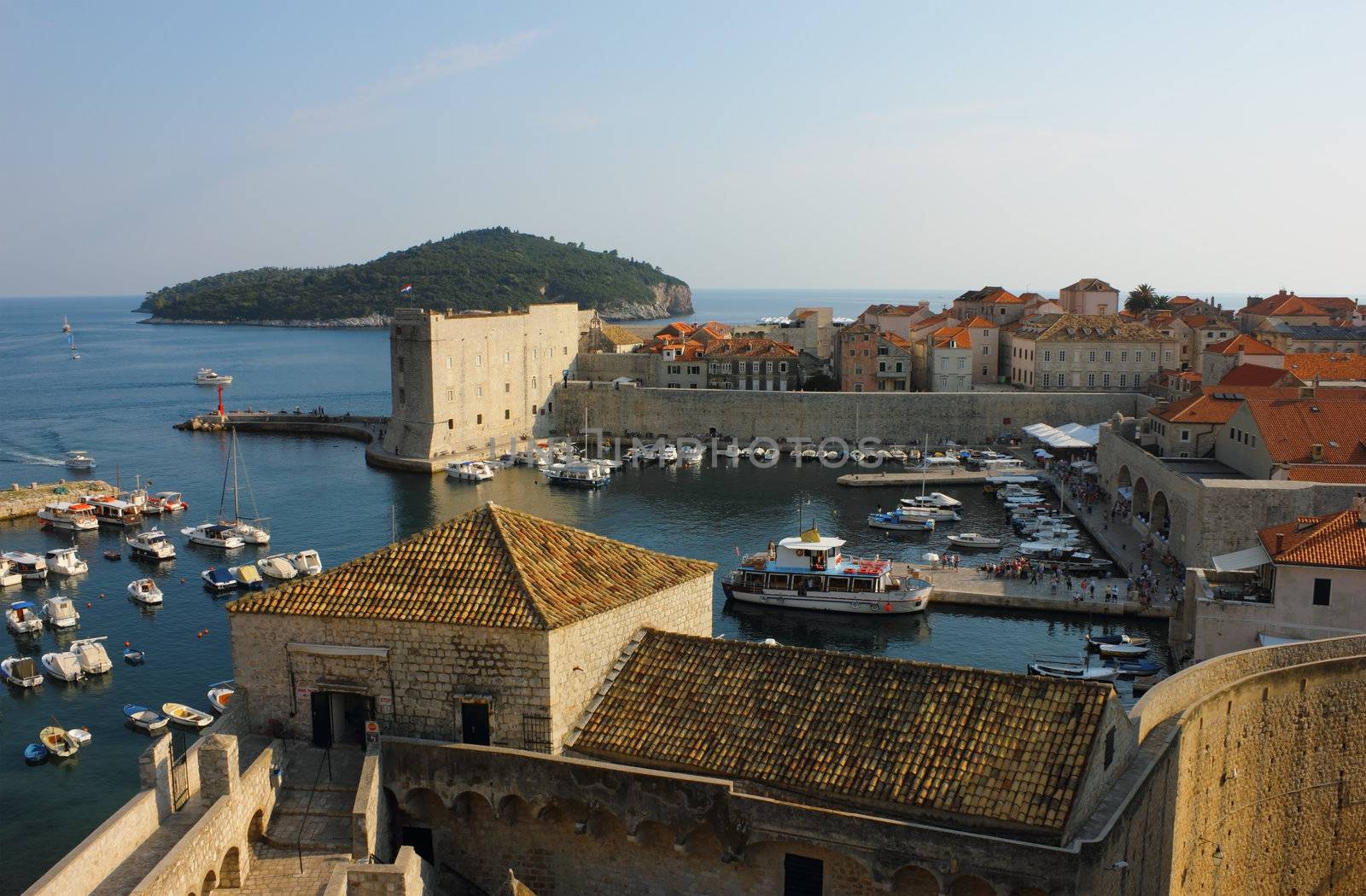 Dubrovnik old Town Harbor panoramic view with island Lokrum in the distance. 