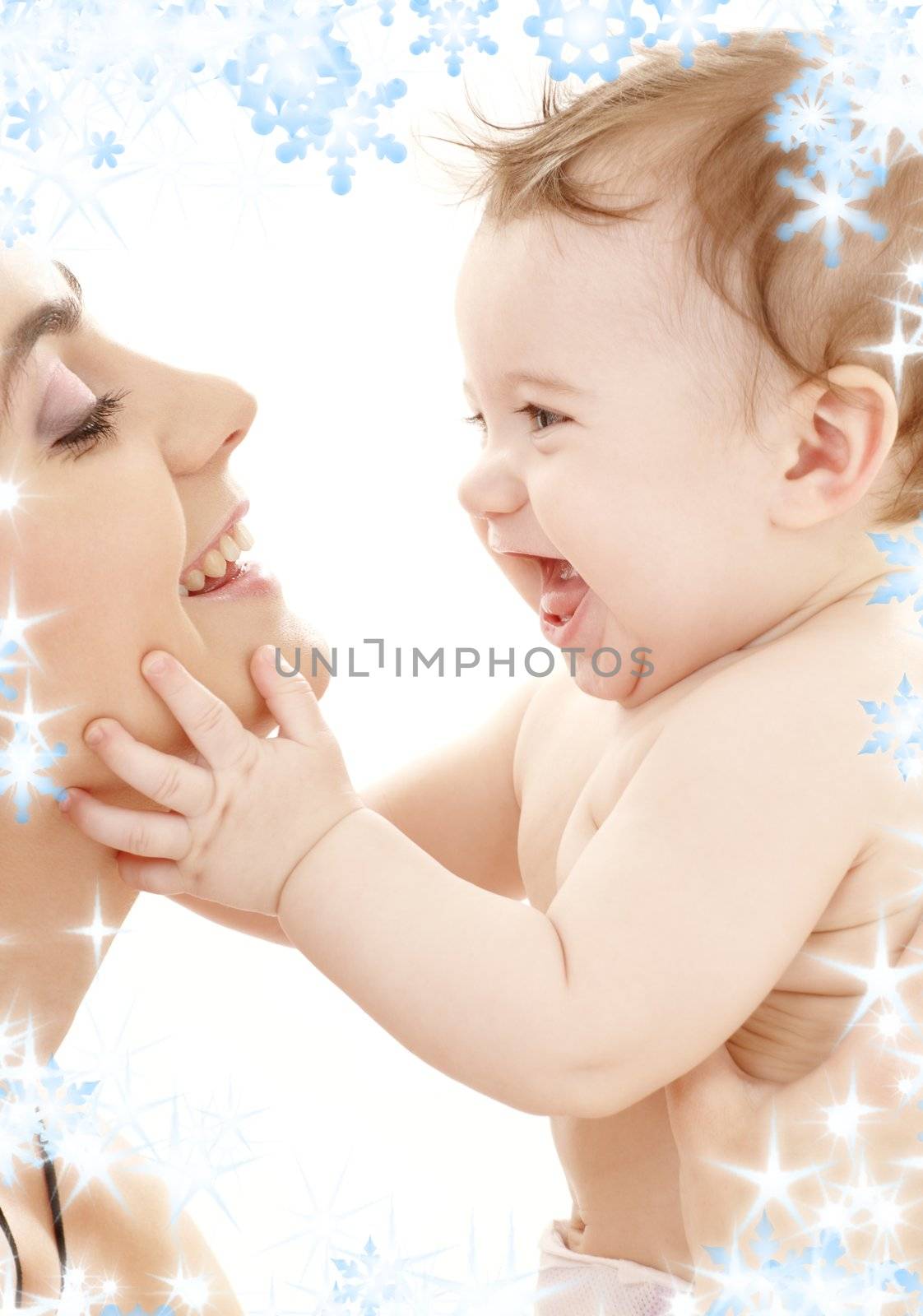 picture of happy mother with baby boy and snowflakes
