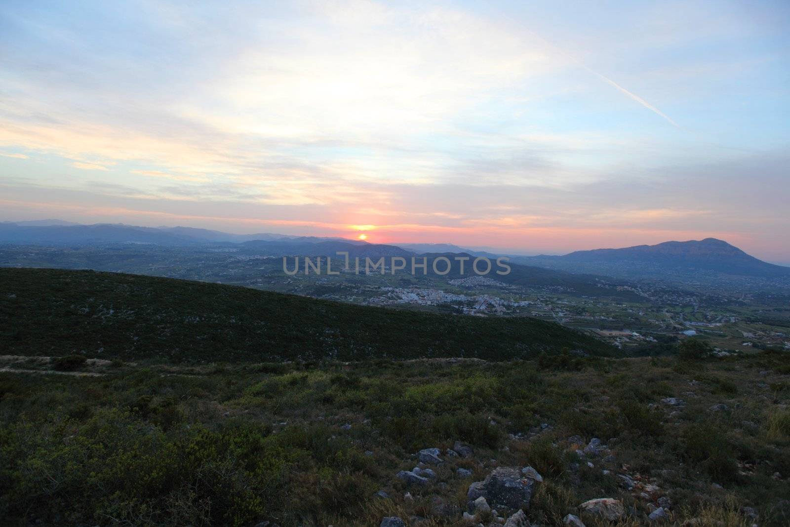 Summer landscape in mountains with the sun