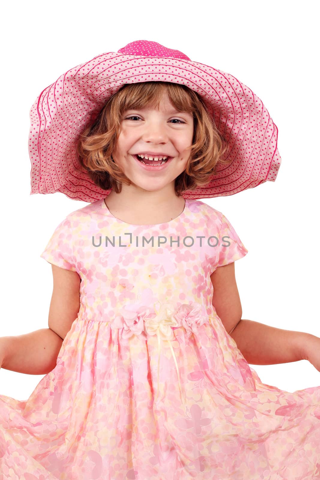 happy little girl with big hat posing