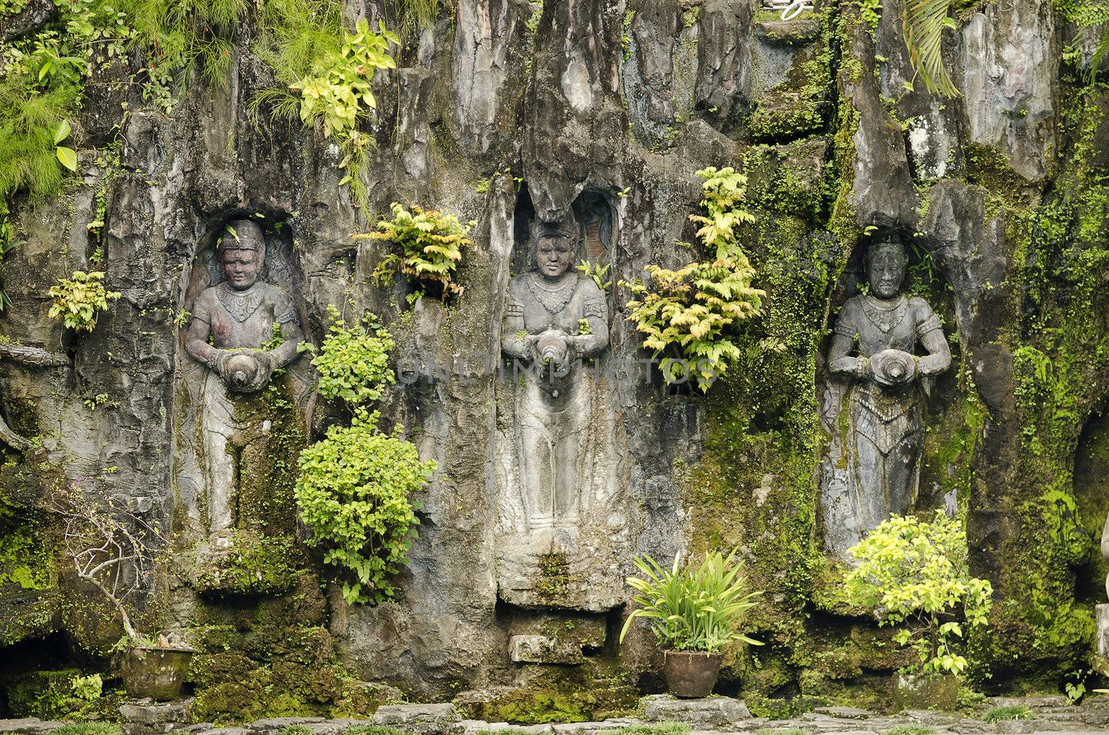 statues in bali indonesia garden by jackmalipan