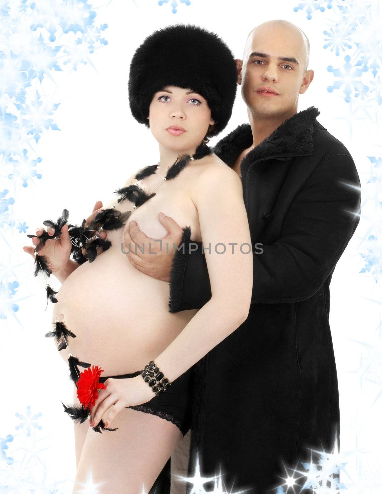 picture of pregnant woman and her man wearing black fur