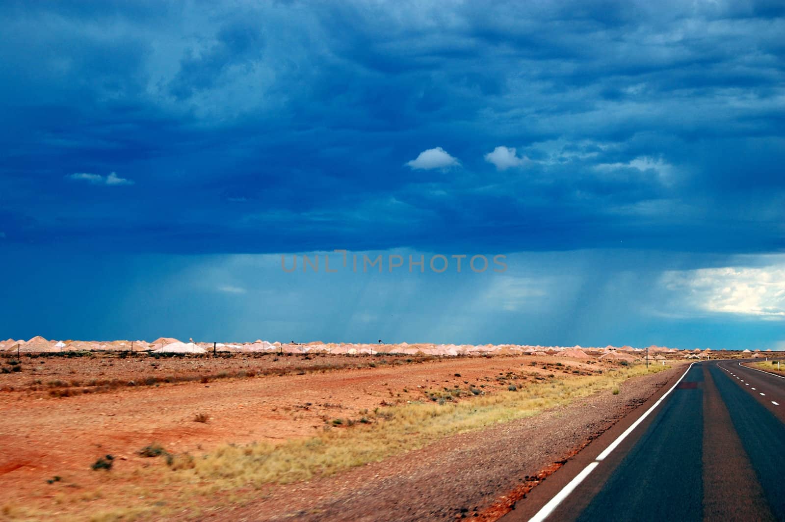 Cloudy sky over highway, Coober Pedy, Northenr Territory, Australia