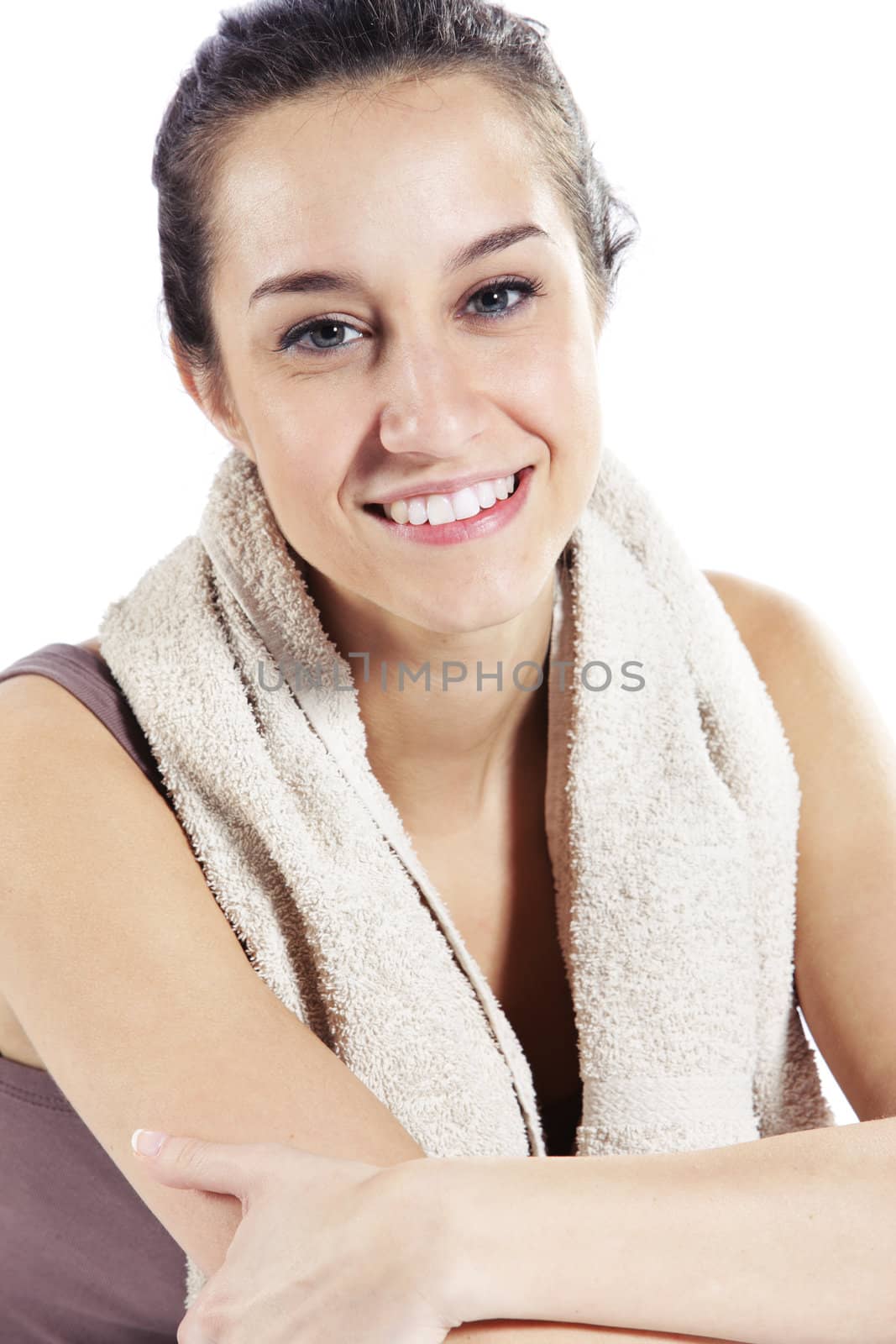 Young Woman In Fitness Clothing Resting After Exercise by stokkete