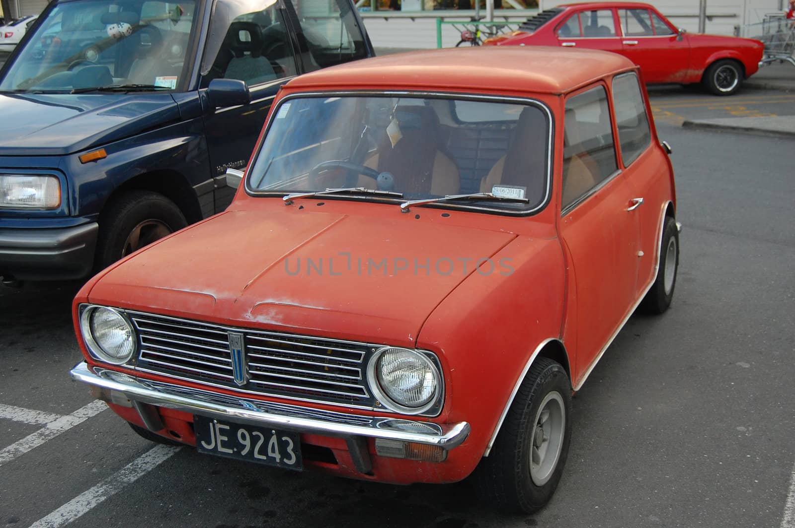 Red retro car at the parking area, New Zealand