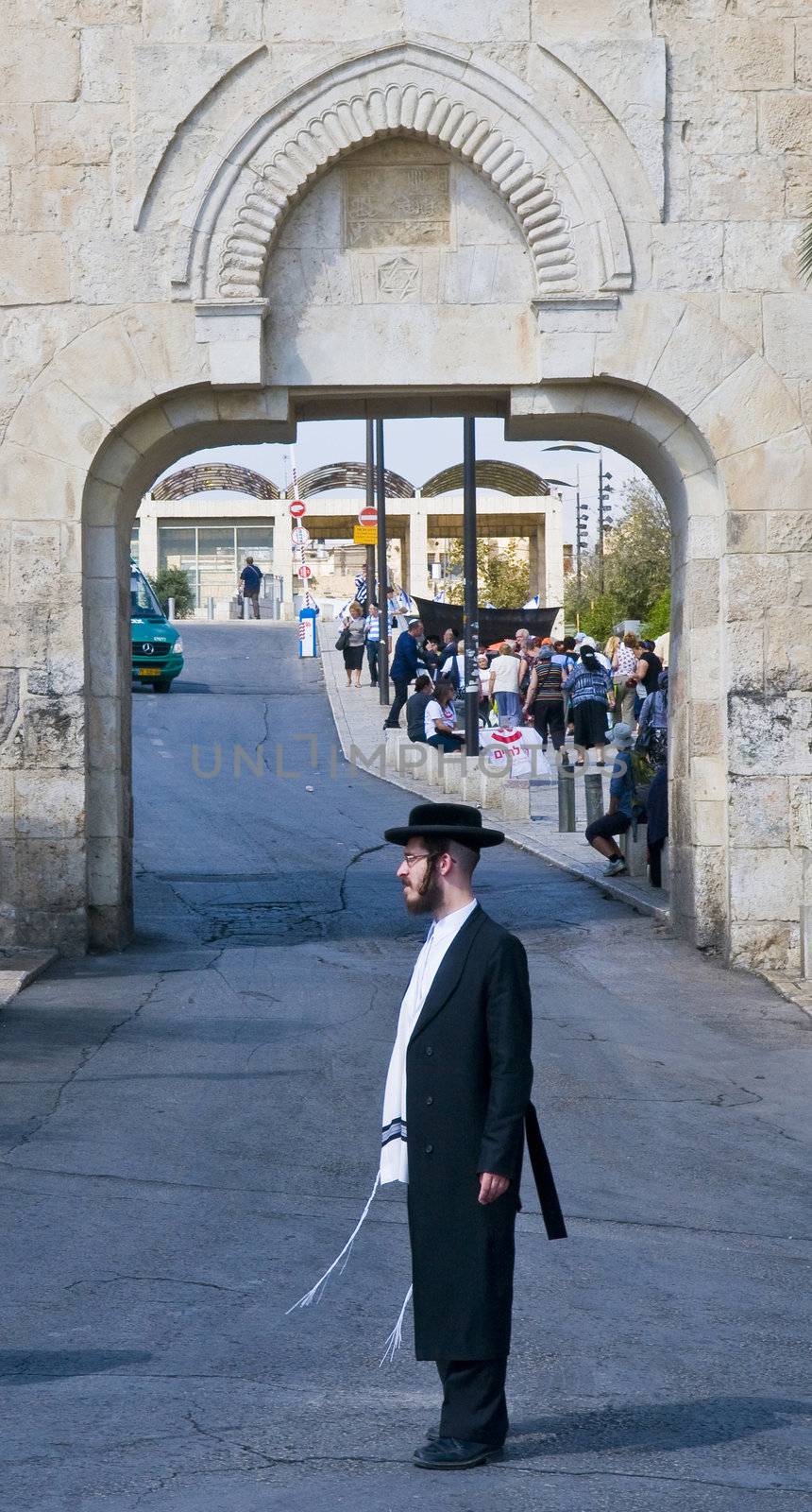 JERUSALEM - OCTOBER 06 2011 : An ultra- Orthodox Jewish man stand near the Dung gate in the old city of Jerusalem , Israel