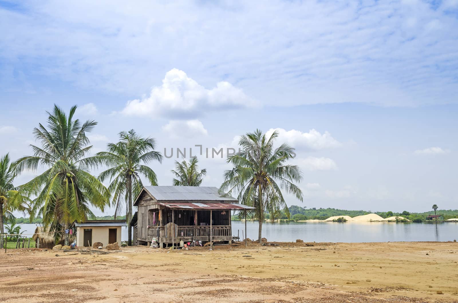 village house by river in rural cambodia